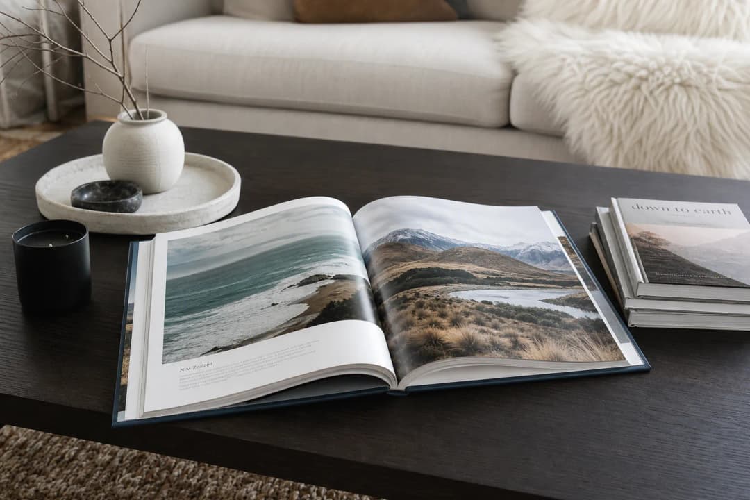 Elegant custom coffee table photo book displayed on a modern living room coffee table